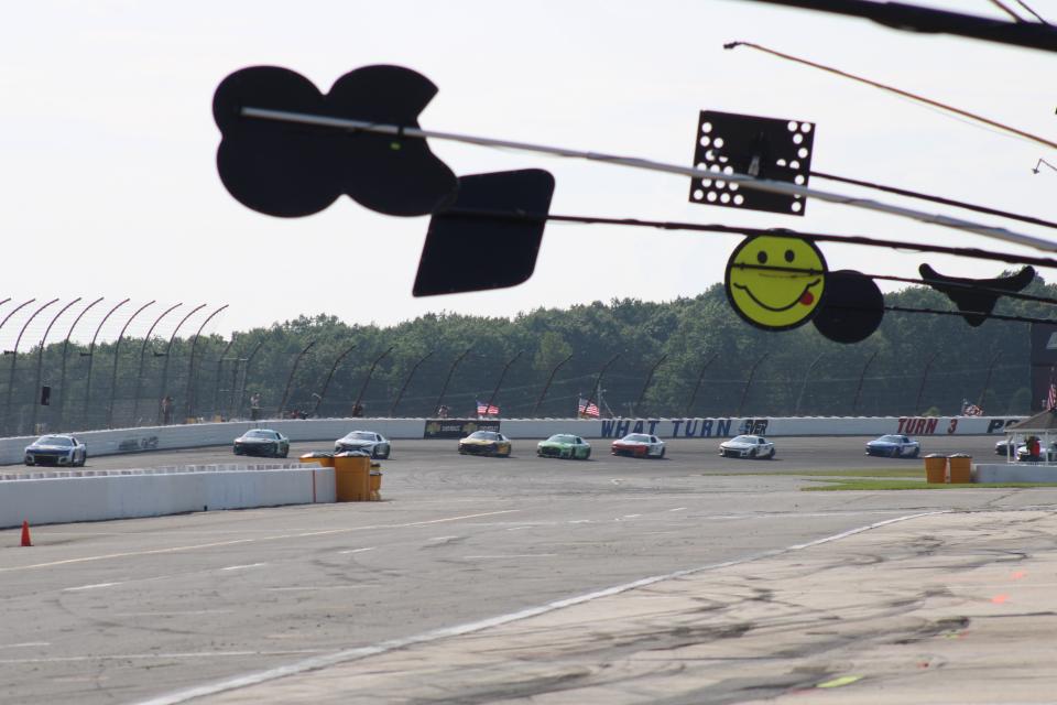 Drivers come out of Turn 3 during the NASCAR Cup Series race at Pocono Raceway on Sunday, July 23, 2023. The wall that typically says "WHAT TURN 4?" says "WHAT TURN 4EVER" this weekend in honor of retiring No. 4 driver Kevin Harvick.