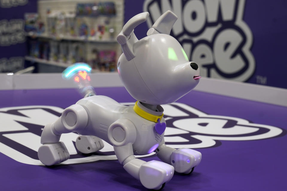 Dog-E, whose lighted wagging tail shows hearts, is displayed at the 2023 Toy Fair, in New York's Javits Center, Monday, Oct. 2, 2023. The app-connected robotic dog from WowWee that was originally marketed to kids and families is finding buzz with the over 65-crowd. (AP Photo/Richard Drew)