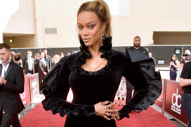 Twenty-two years after making history as the first black model featured on the cover of Sports Illustrated Swimsuit, Tyra Banks is gracing the cover again.Banks, who has been featured in the annual swim edition multiple times before, received her first solo cover in 1997, after starring on the cover alongside model Valeria Mazza the year before.On Wednesday, the magazine announced the supermodel and TV personality had earned the honour again.The 45-year-old supermodel came out of modelling retirement specifically for the shoot, which was photographed by Laretta Houston in Great Exuma, Bahamas.In the photos, Banks, who paved the way for other models of colour in the industry, poses in a yellow Andi Bagus string bikini.Of the opportunity, the supermodel said on Good Morning America: “My first one was 23 years ago, how crazy is that. I’m like ‘Damn, I’m 45 dog!’”> View this post on Instagram> > @tyrabanks, @camillekostek and @alexmorgan13 have landed the cover of SISwim 2019! ✨ “The three women that make up the covers of the 2019 Sports Illustrated Swimsuit Issue represent the brand in the most powerful way possible,” @mj_day said. “While each individual woman is so unique, they come together cohesively to tell a spectacular story."> > A post shared by Sports Illustrated Swimsuit (@si_swimsuit) on May 8, 2019 at 5:17am PDTAccording to Banks, the idea was to recreate the iconic cover photo from more than two decades ago, which saw her posing in a red-and-pink polka dot bikini.> View this post on Instagram> > “I never thought it would be possible to be 45 years old and on the cover of this magazine again.” ❤️ @tyrabanks is embracing her age and curves for SISwim 2019. • • • @grandisleresort @visitthebahamas grandisleresortexuma> > A post shared by Sports Illustrated Swimsuit (@si_swimsuit) on May 8, 2019 at 5:34am PDT“We couldn’t find the actual one in the archives - so they had it made again and I put it on again. 25 pounds heavier,” she said.During the photo shoot, Banks told SI that she is “telling people that beauty comes in all shapes, sizes and ages,” so she has to “put my money where my mouth is.“I have to make sure my message is pure.”SI Swimsuit editor MJ Day said: “Since Tyra’s first cover in 1996, she’s transformed herself into nothing less than a mogul, a cultural force and a supernova of inspiration and empowerment. She’s kind of the Swimsuit Issue ethos come to life, everything we know this franchise can be.”Banks first started modelling when she was 15 and soon after become a global icon in the industry, featuring on numerous magazine covers and earning the honour of Victoria’s Secret Angel throughout her career.In addition to breaking barriers as an African-American supermodel, she has also co-authored a book, Tyra’s Beauty, Inside and Out, acted in several movies, and created and hosted the reality television show America’s Next Top Model, which ran for twenty-four seasons. The supermodel and body-positive activist is one of three women to earn covers for the 2019 Sports Illustrated Swimsuit issue. Other cover stars include USA National Women’s Soccer team star Alex Morgan and Camille Kostek, the 2018 SI Swimsuit Model Search winner.This year’s issue, which focuses on the theme “Shattering Perceptions,” features 34 women in total, including the magazine’s first burkini-wearing swimsuit model, Halima Aden.