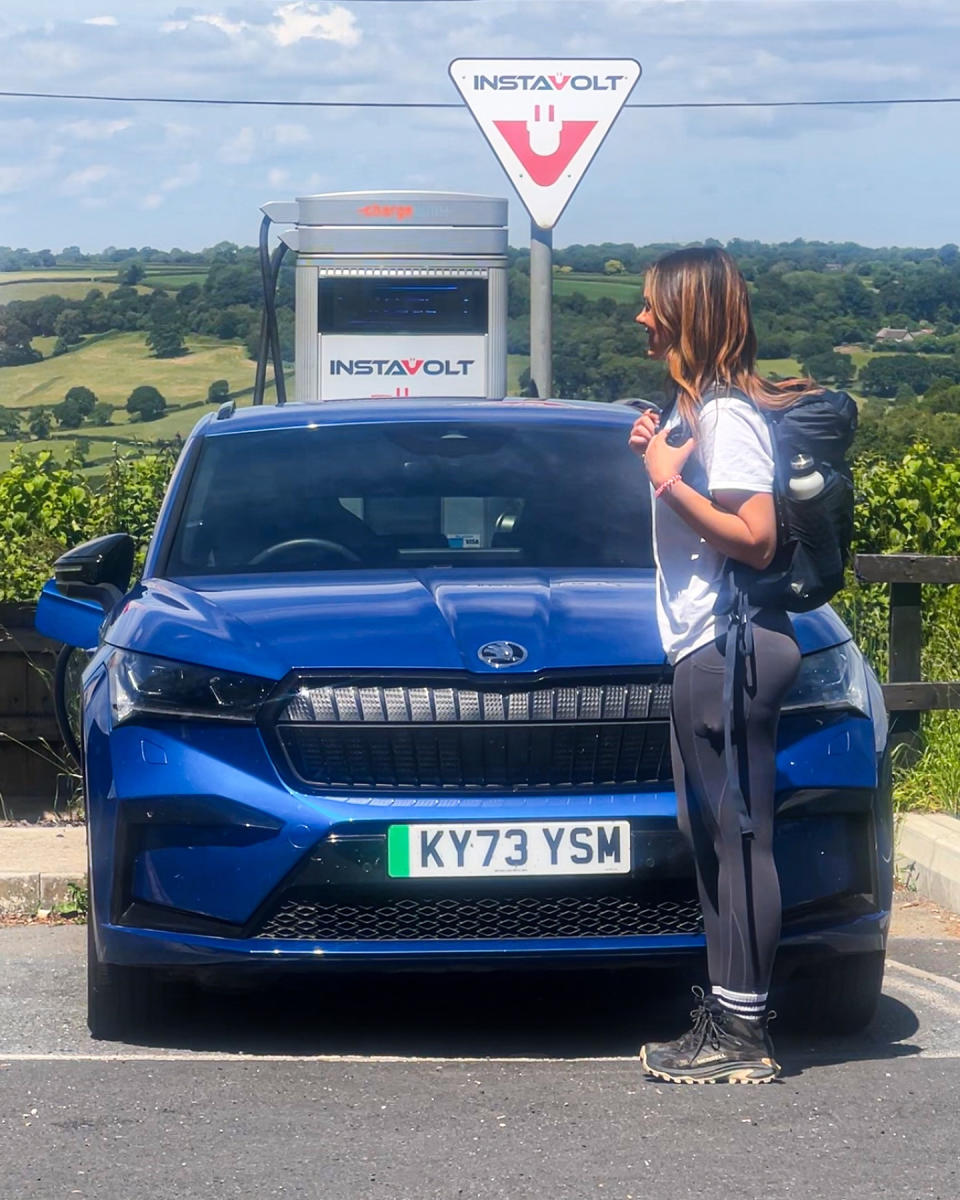 Steph pictured with her electric car. 