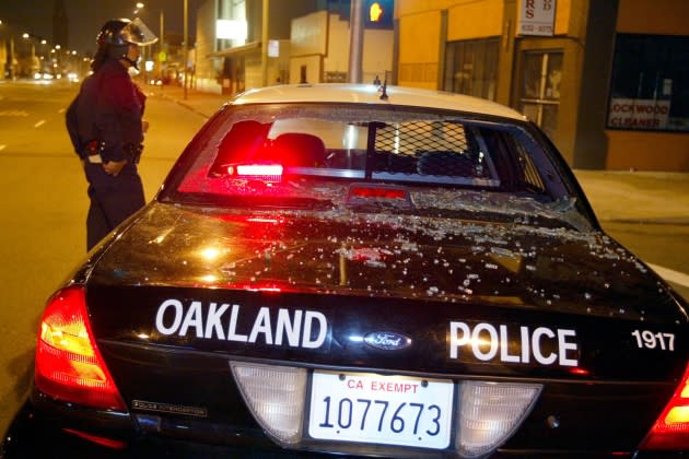 oakland-police-excerpt.jpg Oakland Raiders Fans Take To The Streets After Super Bowl - Credit: Justin Sullivan/Getty Images