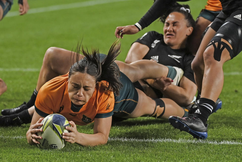 Bienne Terita of Australia scores a try during the Women's Rugby World Cup pool match between Australia and New Zealand, at Eden Park, Auckland, New Zealand, Saturday, Oct.8. 2022. (Andrew Cornaga/Photosport via AP)