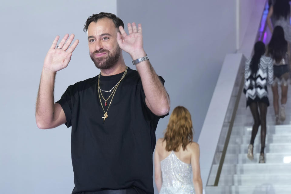 Filippo Grazioli accepts applause at the end of the Missoni women's Spring Summer 2023 fashion show presented in Milan, Italy, Friday, Sept. 23, 2022. (AP Photo/Antonio Calanni)