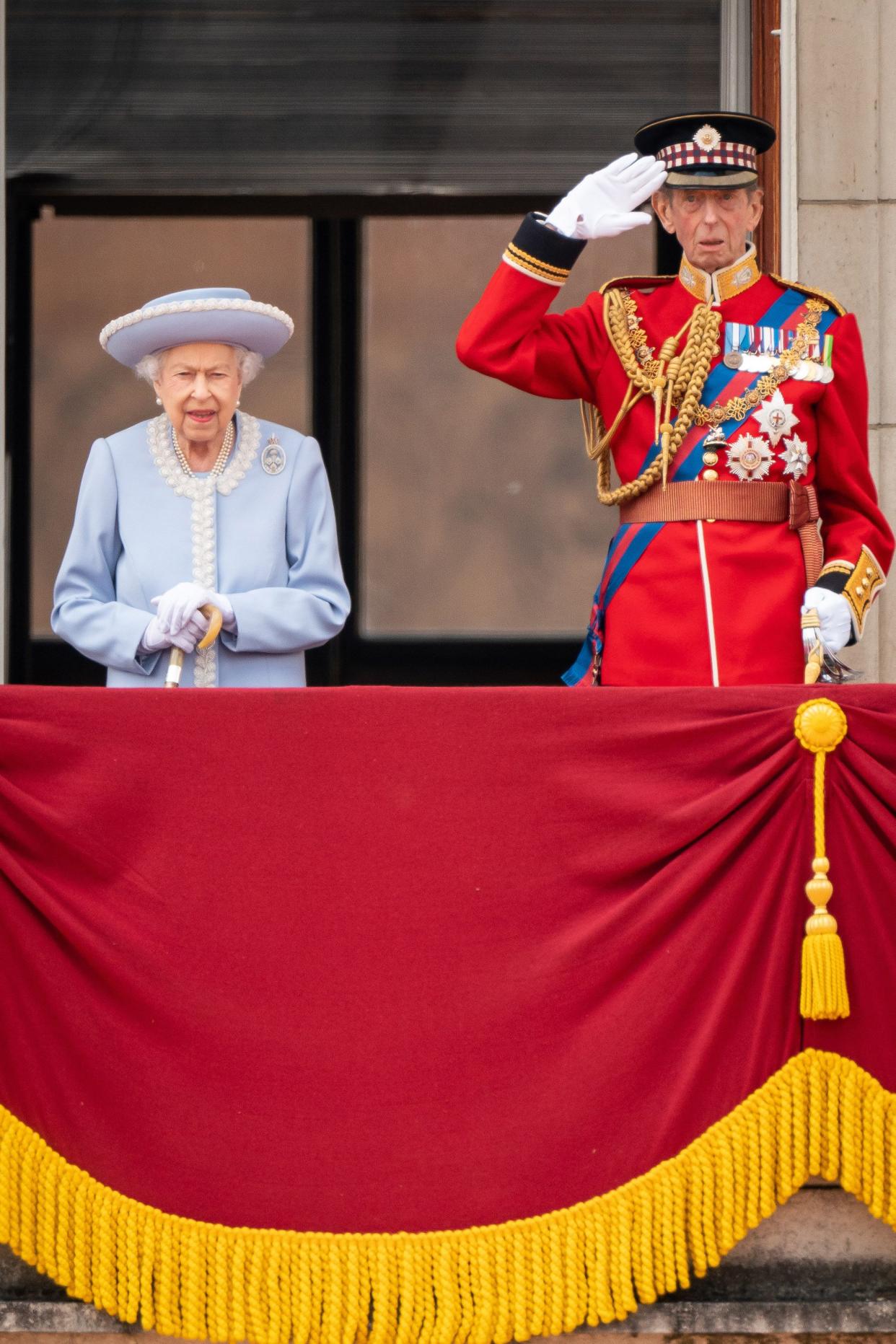 Queen Elizabeth II and Prince Edward, Duke of Kent watch from the balcony at Buckingham Palace for the Trooping the Colour ceremony parade on June 2, 2022, in London, England.