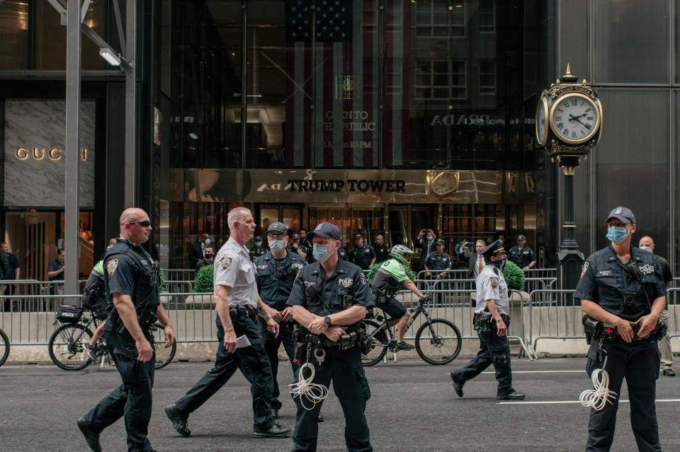 NEW YORK, NY - JUNE 11: NYPD officers stand in front of a barricaded Trump Tower as a march against police brutality passes by the building on June 11, 2020 in New York City. Demonstrations against systemic racism have continued for over two weeks since the killing of George Floyd, an unarmed black man, by a Minneapolis Police officer on May 25th.(Photo by Scott Heins/Getty Images)