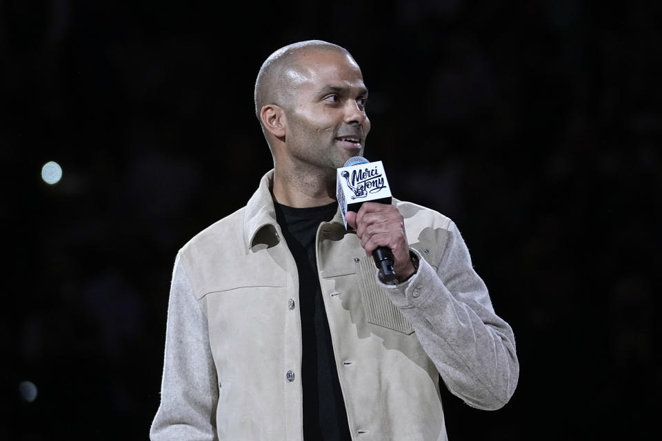 Former San Antonio Spurs guard Tony Parker speaks as he is honored during an NBA basketball game between the Spurs and the New Orleans Pelicans in San Antonio, Sunday, Dec. 17, 2023. (AP Photo/Eric Gay)