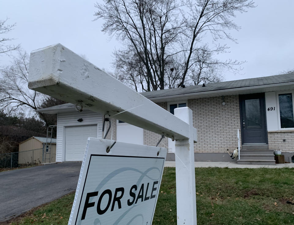 Real estate signage is shown in Oakville, Ont., west of Toronto, on Friday, Jan.12, 2024. THE CANADIAN PRESS/Richard Buchan