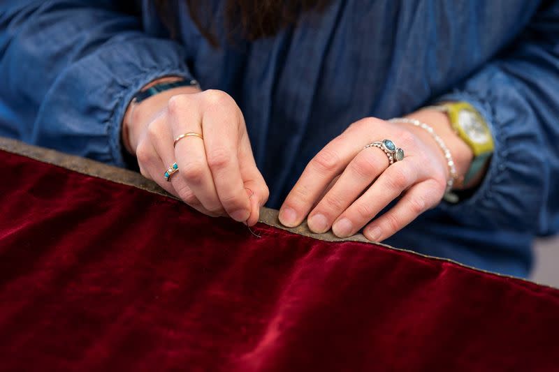 Work is carried out on Britain's King Charles's Robe of State