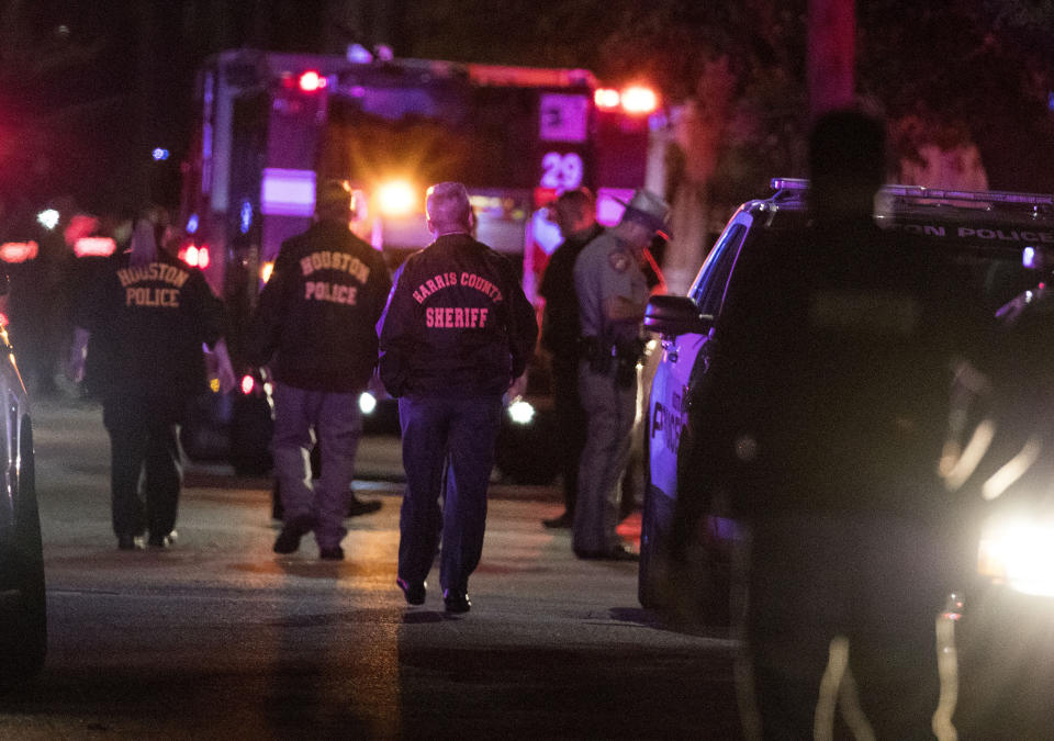 FILE - In this Monday, Jan. 28, 2019, file photo, police investigate the scene where several Houston Police officers were shot in Houston. A woman was sentenced on Tuesday, June 8, 2021, to three years and four months in federal prison for making false 911 calls that ultimately resulted in the 2019 drug raid by Houston police that killed both homeowners. Patricia Garcia was the first person to be sentenced in connection with the deadly raid in which Dennis Tuttle, 59, and his wife, Rhogena Nicholas, 58, were fatally shot on Jan. 28, 2019. (Brett Coomer/Houston Chronicle via AP, File)