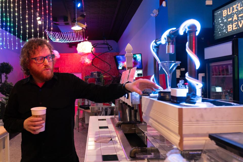 Alway thinking about innovation, Chris Shultz, owner of 909 and 911 S. Kansas Ave., shows a new martini and build-a-bev machine inside Cosmo Court. Shultz plans to start taking reservations for the new business in February.