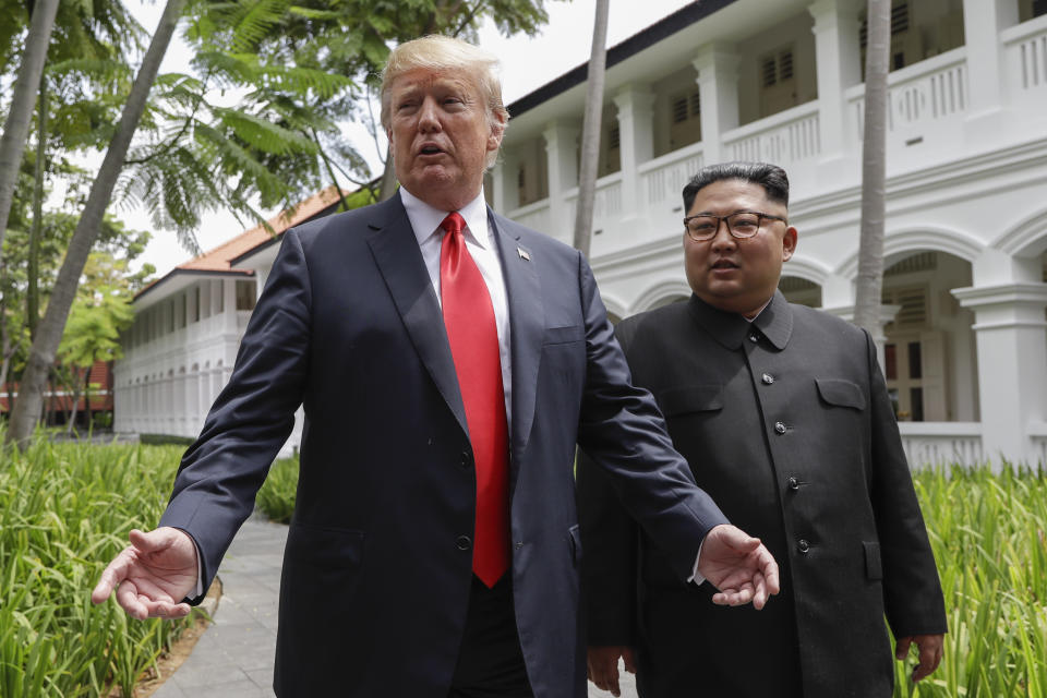 In this June 12, 2018, file photo, U.S. President Donald Trump and North Korea leader Kim Jong Un stop to talk with the media as they walk from their lunch at the Capella resort on Sentosa Island in Singapore. Trump and Kim are planning a second summit in the Vietnam capital of Hanoi, Feb. 27-28. (AP Photo/Evan Vucci, File)