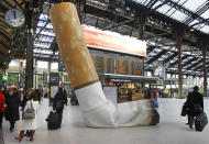 A symbolic cigarette butt is set up inside Gare de Lyon railway station, in Paris, Tuesday Dec. 4, 2012, as part of a publicity campaign against rudeness, by Paris's public transport authority. The possibility of apparent rudeness is being counteracted by an advertising campaign as tourism companies and the Paris transport authority address concerns of tourists during the financial crisis. (AP Photo/Remy de la Mauviniere)