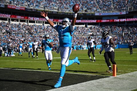 Carolina Panthers quarterback Cam Newton (1) scores a touchdown in the fourth quarter at Bank of America Stadium - Credit: Bob Donnan/USA Today