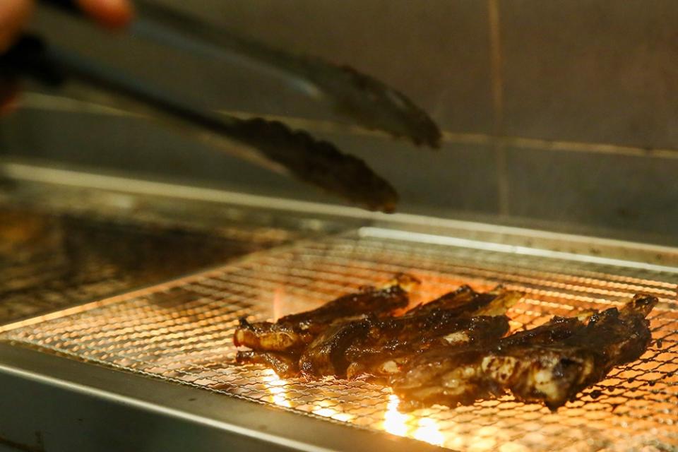 Lamb Ribs are marinated and grilled on the hot fire with a brush of sauce made with Syrian spices.
