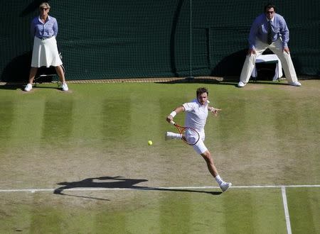 Stan Wawrinka of Switzerland hits a shot during his match against David Goffin of Belgium at the Wimbledon Tennis Championships in London, July 6, 2015. REUTERS/Suzanne Plunkett