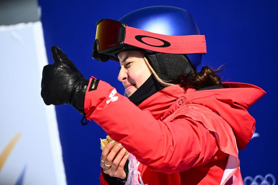 China's Eileen Gu gestures as she waits for her score in the freeski slopestyle qualification run during the 2022 Winter Olympic Games at the Genting Snow Park H & S Stadium in Zhangjiakou, China on February 14, 2022. (MARCO BERTORELLO/AFP via Getty Images)