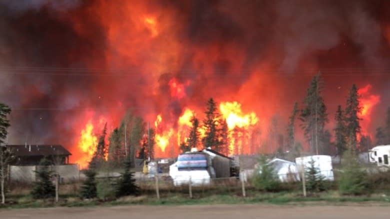 A wildfire approaches homes in Fort McMurray, Alberta on May 3, 2016. CBC News