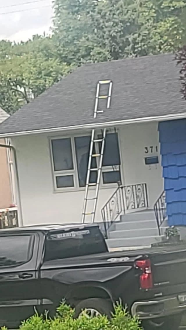 ladder looks like it's going through the roof