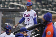 New York Mets starting pitcher Marcus Stroman leaves the field at the start of a rain delay during the first inning of a baseball game against the Miami Marlins at Citi Field, Sunday, April 11, 2021, in New York. The game was delayed at the top of the first inning due to rain. (AP Photo/Seth Wenig)