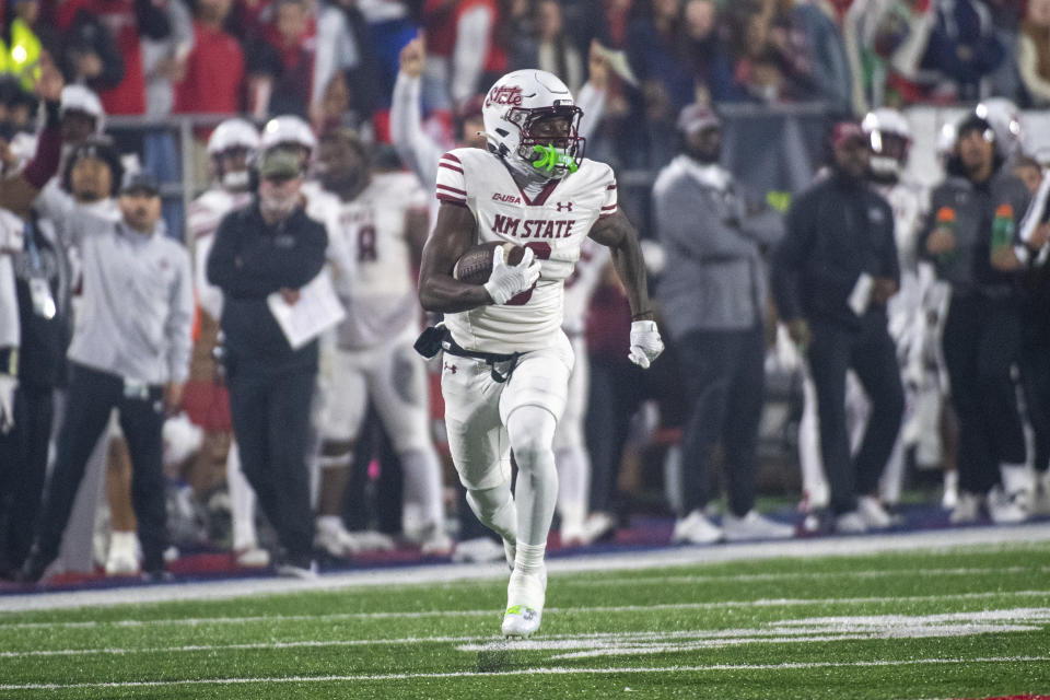 New Mexico State's Jonathan Brady runs for a touchdown against Liberty during the second half of the Conference USA championship NCAA college football game Friday, Dec. 1, 2023, in Lynchburg, Va. (AP Photo/Robert Simmons)