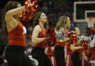 Wisconsin cheerleaders perform during the first half of a second-round game in the NCAA college basketball tournament Thursday, March 20, 2014, in Milwaukee. (AP Photo/Morry Gash)