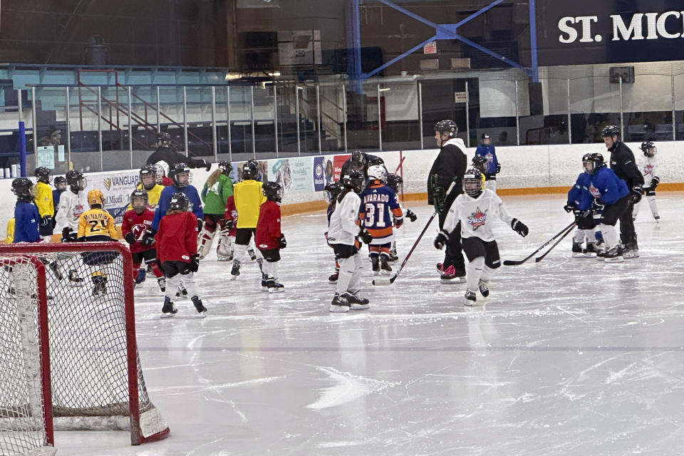 Players from around North America take part in the NHL All-Star Youth Hockey Jamboree Celebration at St. Michael's College School Arena in York, Ontario, Saturday, Feb. 3, 2024, during All-Star Weekend in Toronto. While Canada has seen a steep decline in children playing hockey in the sport's birthplace, the United States has experienced steady growth in that department over the past decade.(AP Photo/Stephen Whyno)