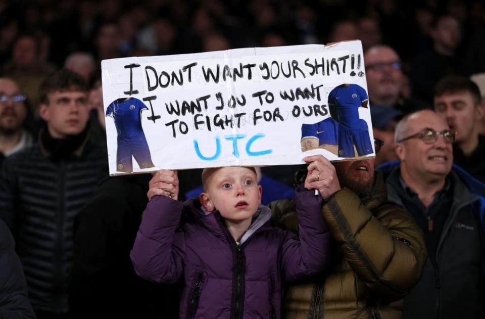 A young Chelsea fan sends a message from the away end (Getty Images)