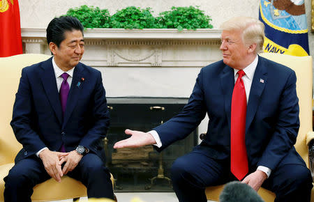 FILE PHOTO: U.S. President Donald Trump meets with Japanese Prime Minister Shinzo Abe in the Oval Office of the White House in Washington, U.S., June 7, 2018. REUTERS/Kevin Lamarque/File Photo