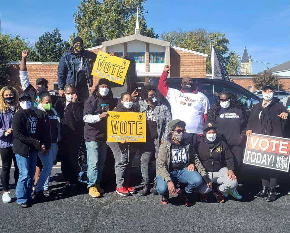 Savvy Shabazz (center, arm raised) is seen with members of the group All of Us or None Louisville during a voter registration and canvassing drive in Paducah, Kentucky, last fall. (Photo: Savvy Shabazz/All of Us or None Louisville)