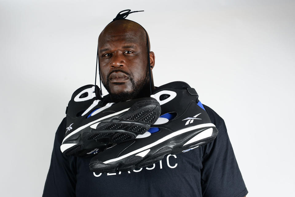 PHILADELPHIA, PA - JULY 09:  Former NBA basketball player Shaquille O'Neal poses with Reebok sneakers at the Reebok Classic Breakout at Philadelphia University on July 9, 2014 in Philadelphia, Pennsylvania.  (Photo by Lisa Lake/Getty Images for Reebok)