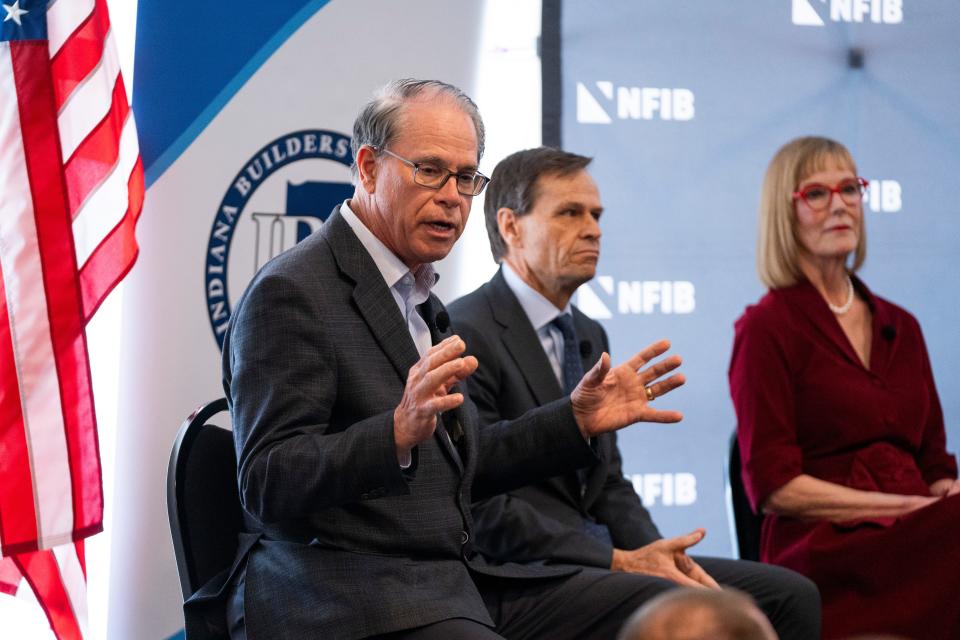 Sen. Mike Braun, left, addresses the audience during the National Federation of Independent Businesses gubernatorial candidate forum and luncheon on Tuesday, March 19, 2024, at the Wellington Fishers Banquet & Conference Center in Fishers, Indiana.