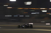 Mercedes driver Lewis Hamilton of Britain steers his car during the qualifying session at the Formula One Bahrain International Circuit in Sakhir, Bahrain, Saturday, Nov. 28, 2020. (Brynn Lennon, Pool via AP)