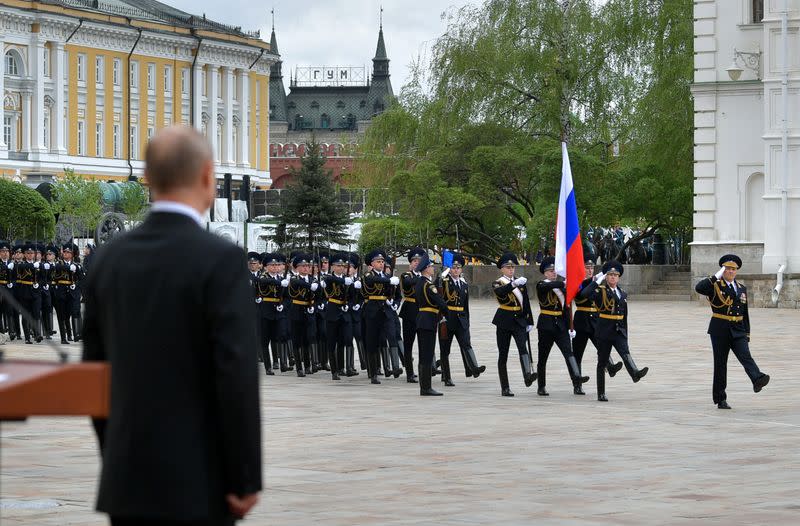 Russian President Putin watches honour guards marching in Cathedral Square at the Kremlin during the celebrations of Victory Day in central Moscow