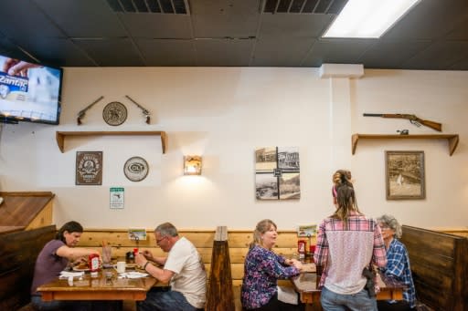 Waitress Jessie Spaulding serves customers at Shooters Grill in Rifle, Colorado on April 24, 2018