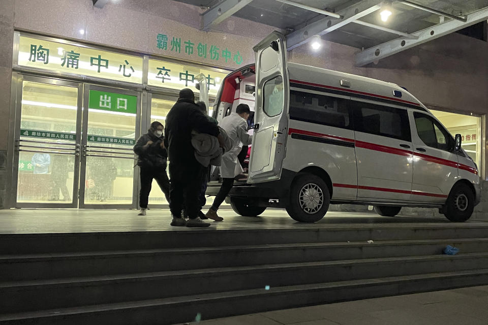 An ambulance prepares to transfer a patient in critical care to other hospitals due to overcapacity at the emergency department of the Langfang No. 4 People's Hospital in Bazhou city in northern China's Hebei province on Thursday, Dec. 22, 2022. As China grapples with its first-ever wave of COVID mass infections, emergency wards in the towns and cities to Beijing's southwest are overwhelmed. Intensive care units are turning away ambulances, residents are driving sick relatives from hospital to hospital, and patients are lying on floors for a lack of space. (AP Photo)