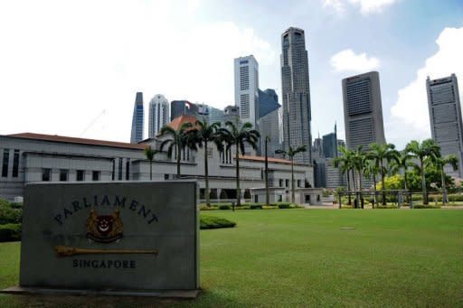 A view of the Parliament House compound in Singapore. Singapore is to slash its leaders' unpopular multi-million-dollar salaries by at least a third, but they will remain the world's best-paid politicians