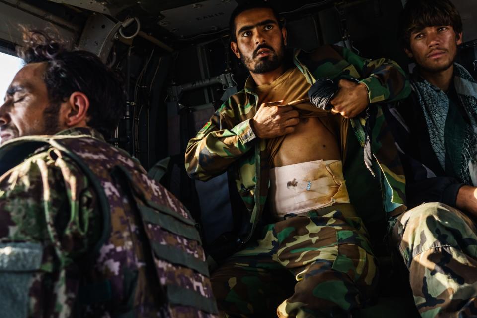 Soldiers, some wounded by Taliban gunfire, are aboard an UH-60 Blackhawk.