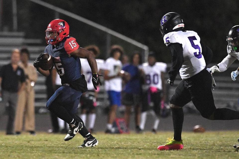 Jordan’s Amareon Blue (15) runs for the touchdown ahead of Riverside’s Jaylen Hargroves (5) in the first quarter. The Riverside Pirates and the Jordan Falcons met in a conference football game in Durham, N.C. on October 13, 2023.