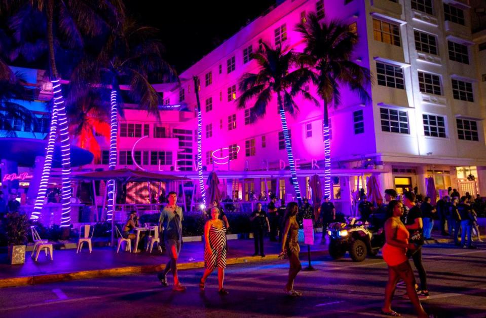 People fill the streets in front of the Clevelander during spring break in Miami Beach, Florida, on Saturday, March 19, 2022.