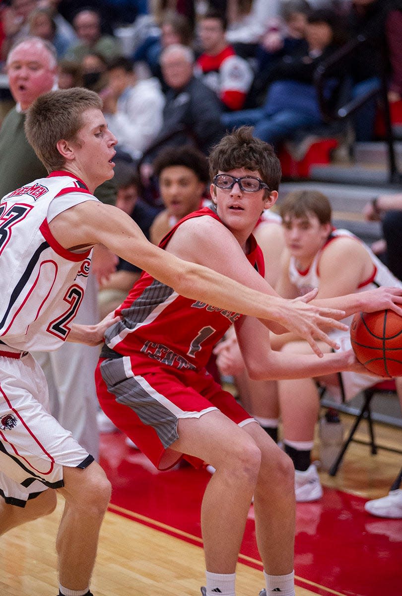 Buckeye Central's Drew Rose looks to pass around Bucyrus' Malachi Bayless.