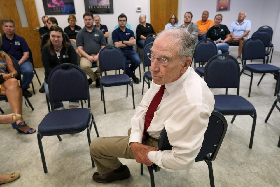 In this June 30, 2021, photo Sen. Chuck Grassley, R-Iowa, listens to a question during a meeting with employees at Professional Computer Solutions in Denison, Iowa. (AP Photo/Charlie Neibergall)