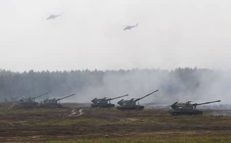 Armoured vehicles and helicopters take part in the Zapad 2017 war games at a range near the town of Borisov, Belarus September 20, 2017. REUTERS/Vasily Fedosenko