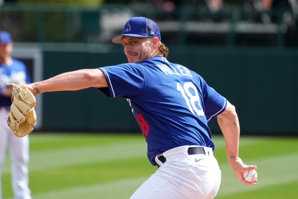 Dodgers pitcher Shelby Miller warms up during the second inning of a spring training baseball game against the Cubs on Sunday, Feb. 26, 2023, in Phoenix.
