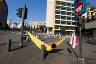 A demonstrator sleeps on a hammock during ongoing anti-government protests near the government palace in downtown Beirut