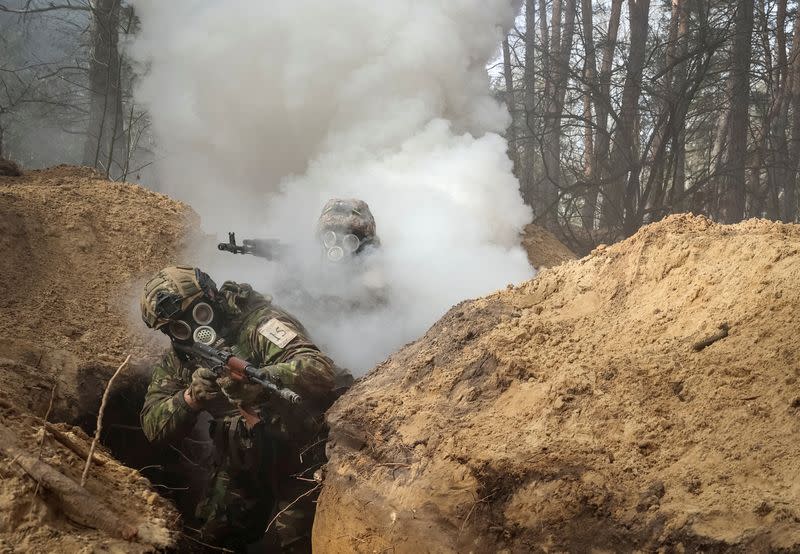 FILE PHOTO: Ukrainian servicemen of the National Guard take part in radiation, chemical and biological hazard drills near Kharkiv