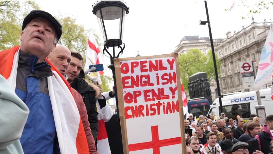 People attend a St George's Day rally on Whitehall, in Westminster, central London.