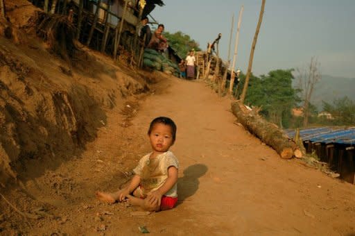 A Kachin child plays in a refugee camp on the border with China in May. China has pushed thousands of refugees from Myanmar's Kachin minority back across the border into a province wracked by fighting between government troops and ethnic guerillas, the rebels said Friday