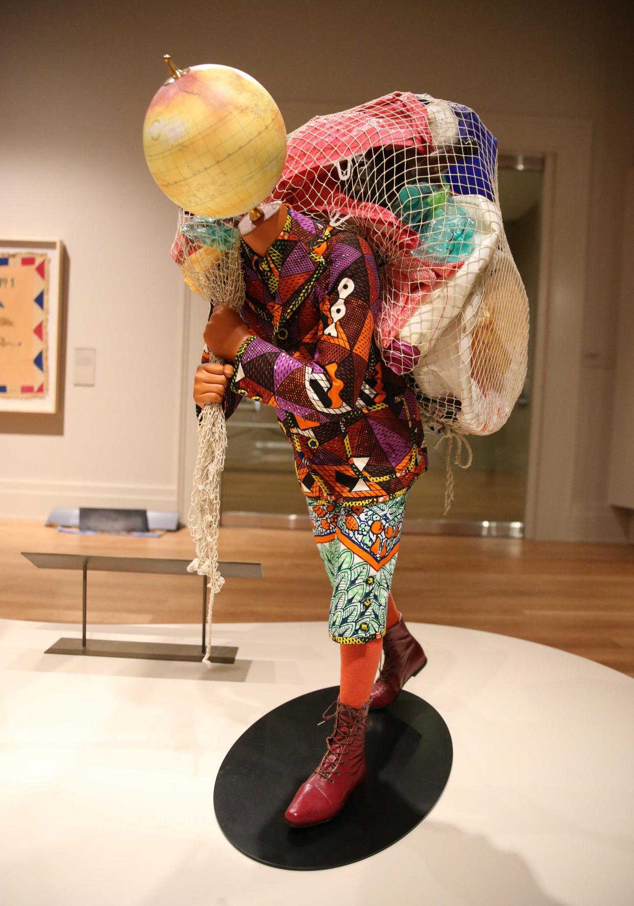 "Earth Kid (Boy)” by Nigerian-British artist Yinka Shonibare makes a statement about protecting the Earth in the African Art galleries at Notre Dame's Raclin Murphy Museum of Art, seen Nov. 15, 2023.