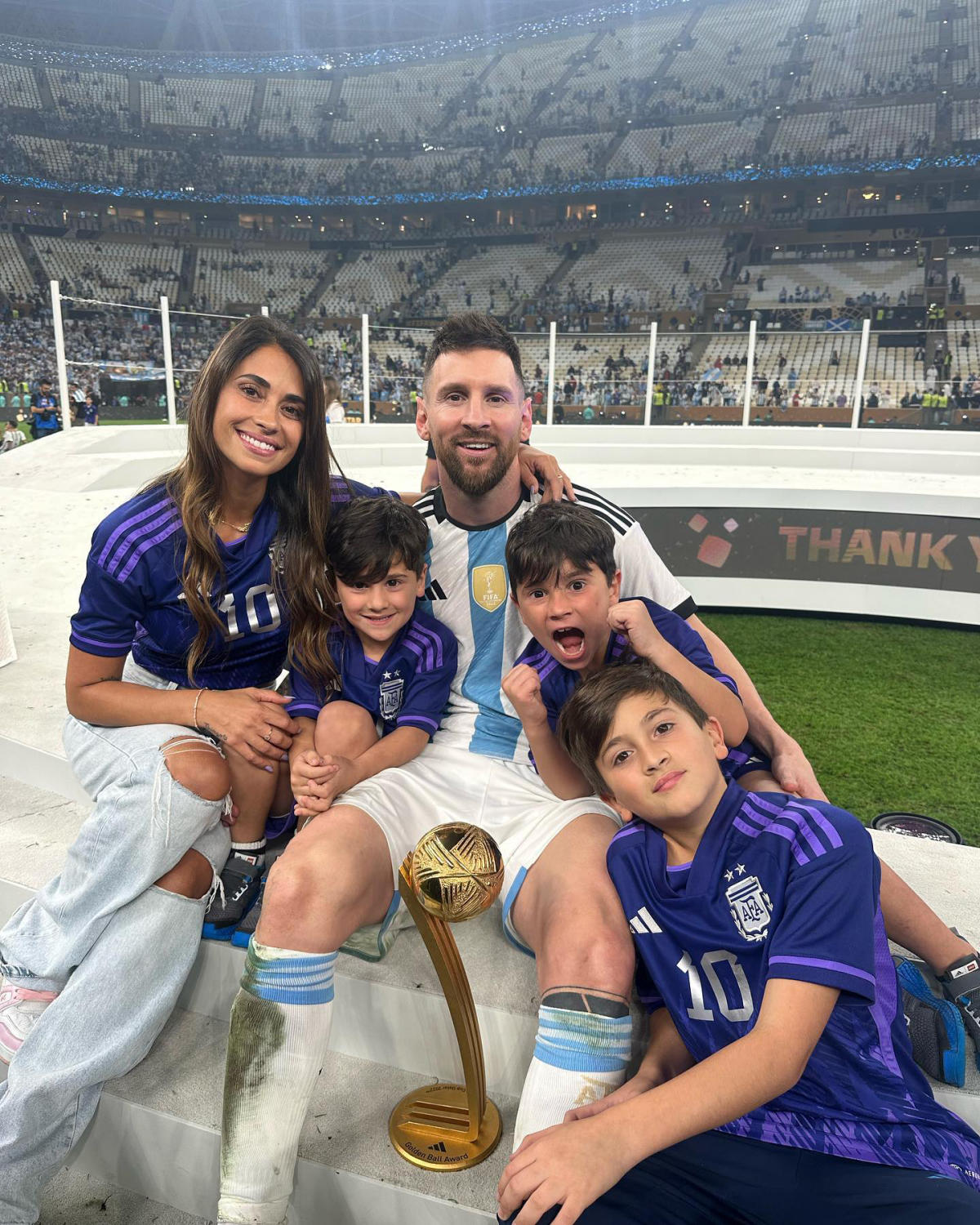 Lionel Messi Kisses His Trophy While Celebrating Win at FIFA World