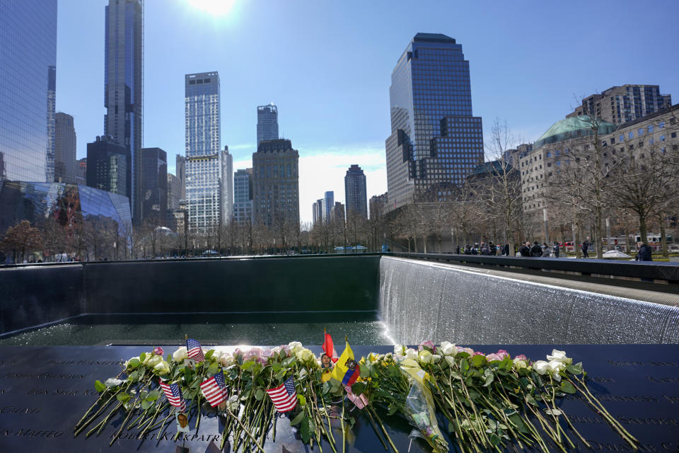 Roses are left next to the names of the victims of the 1993 bombing of the World Trade Center during a ceremony marking the 28th anniversary of the attack, Friday, Feb. 26, 2021, in New York. On Feb. 26, 1993, a truck bomb built by Islamic extremists exploded in the parking garage of the North Tower of the World Trade Center, killing six people and injuring more than 1,000 others. (AP Photo/Mary Altaffer)
